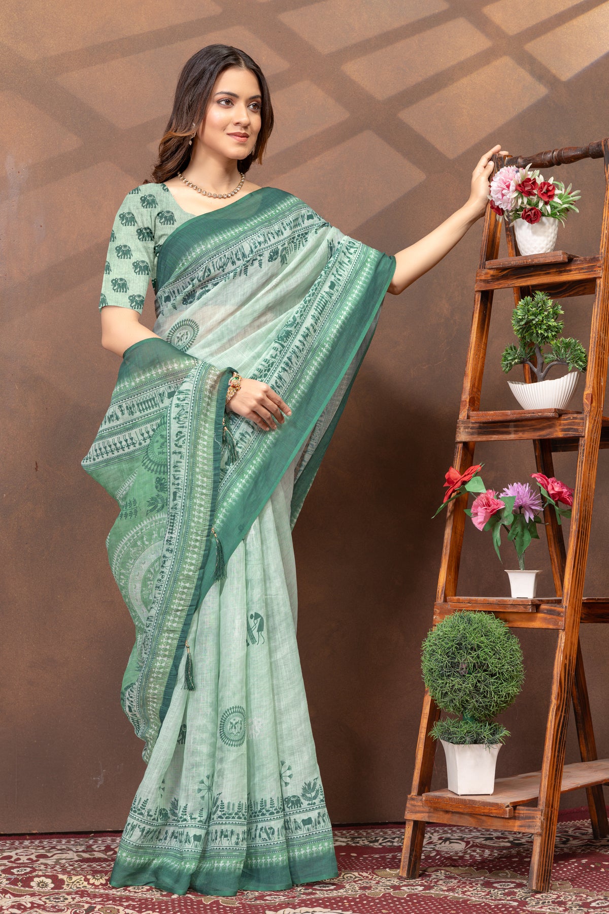 Pastel Green Folk Print Saree with Traditional Woven Border for Women