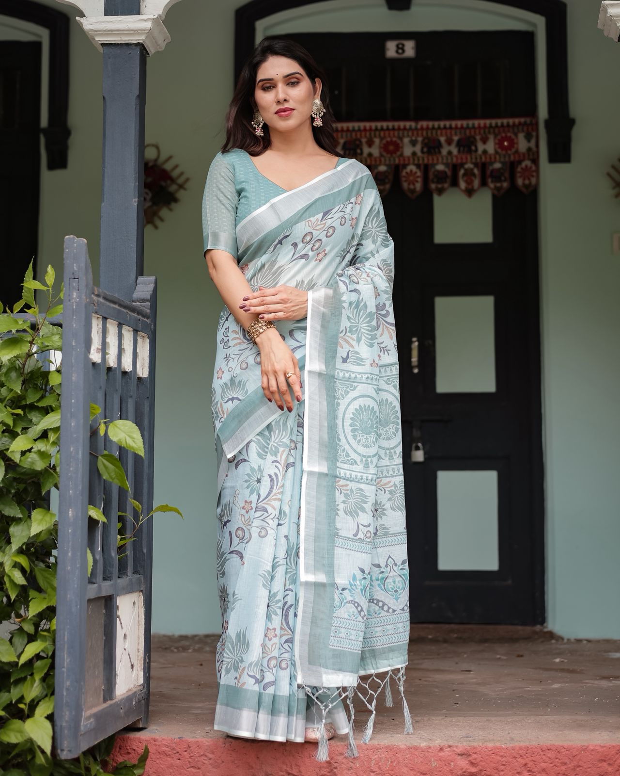 Pastel Green Linen Saree with Elegant Floral Print