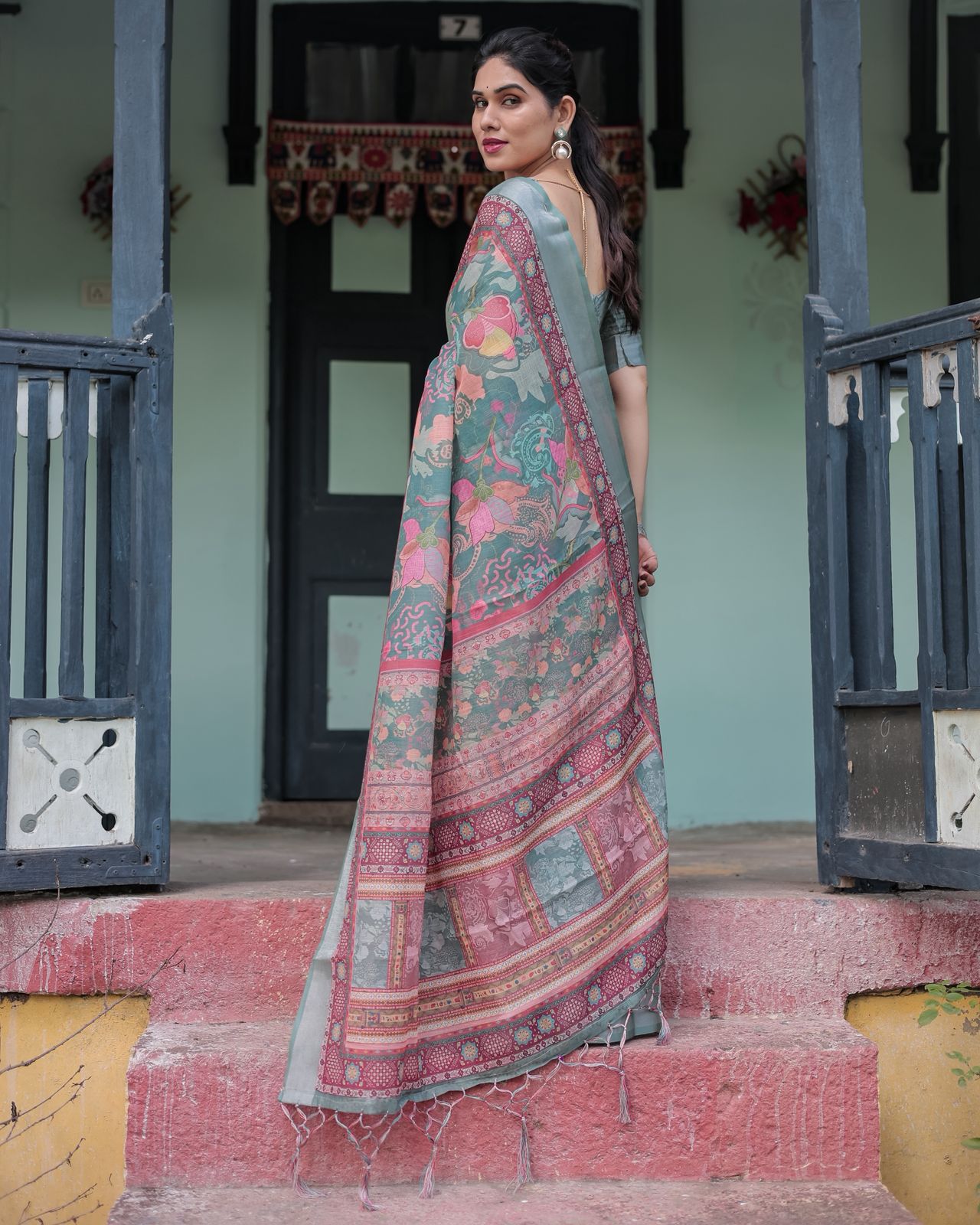 Teal Green Printed Linen Saree with Ethnic Border